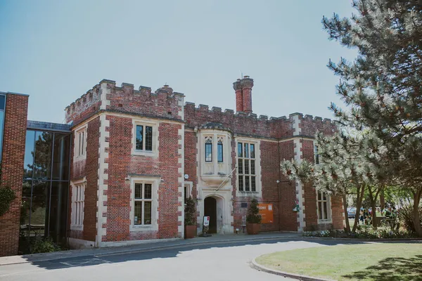 A red brick building that looks a bit like a castle