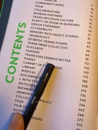 Contents page of the catalogue with a pen against the trans kids deserve better entry