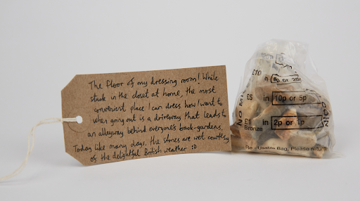 Bag of stones with hand written tag attached.