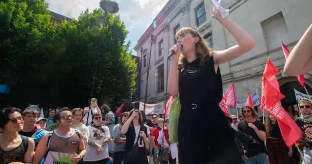 Jenny Maguire addresses the crowd before the 2026 march